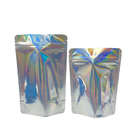 Las galletas olográficas brillantes de aluminio que empaquetan los bolsos 3.5g 7g se colocan encima de bolsas