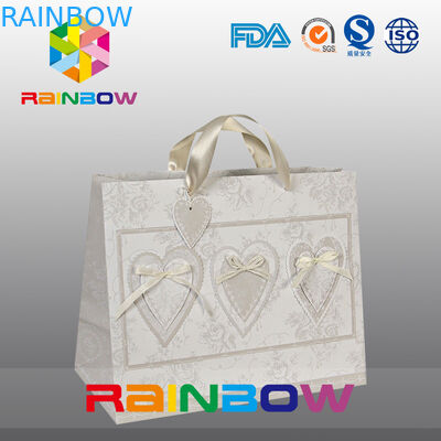 La aduana blanca/roja del diseño único imprimió las bolsas de papel con la manija