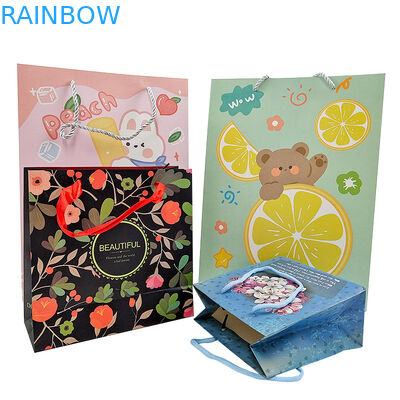 Venta al por mayor de bolsas de papel de regalo de lujo con logotipo impreso a medida Venta al por menor de bolsas de papel de compras