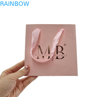 Papel Kraft Blanco de compras de ropa Cosmética Perfume Bolsa de regalo de lujo mango Logotipo personalizado Bolsa de papel impresa para ropa