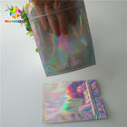 Las bolsas de papel modificadas para requisitos particulares cremallera del holograma olográficas se levantan CMYK para los cosméticos