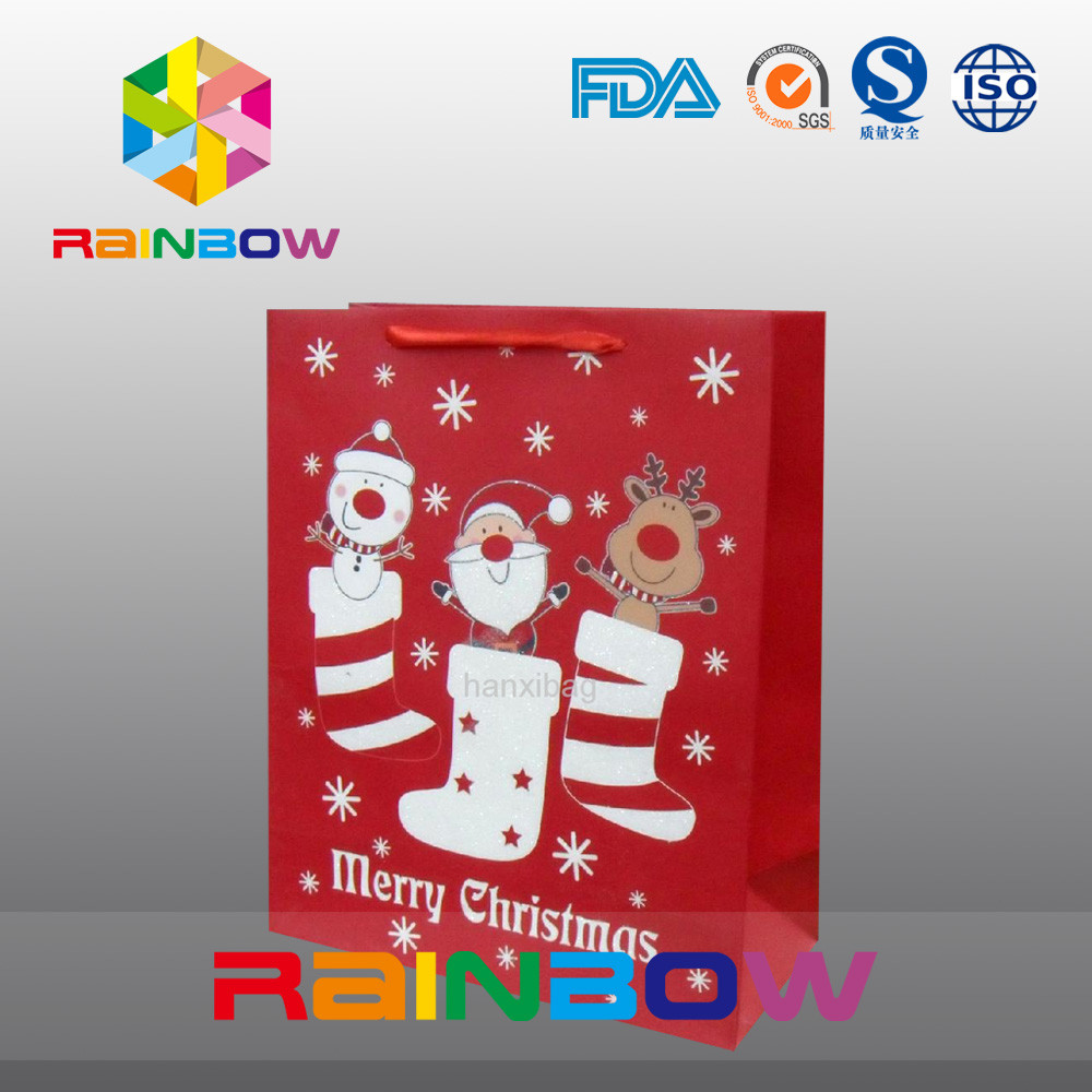 El rojo modificó el bolso del regalo para requisitos particulares de la Navidad de las bolsas de papel con la cuerda roja/lindo impreso