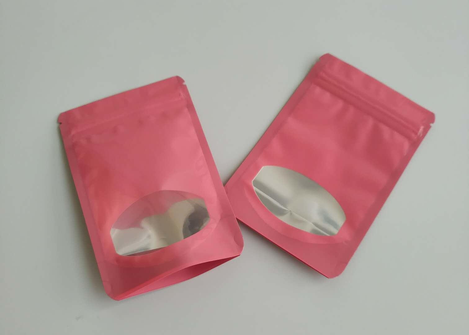 Bolsas plásticas de diversos colores que empaquetan bolsos del caramelo de la fruta del chocolate con claramente la ventana