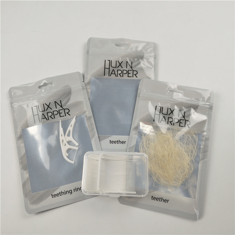 Empaquetado modificado para requisitos particulares claro brillante del bolso de la cerradura de la cremallera del papel de aluminio de las bolsas de plástico del agujero de la caída de la seda dental del frente
