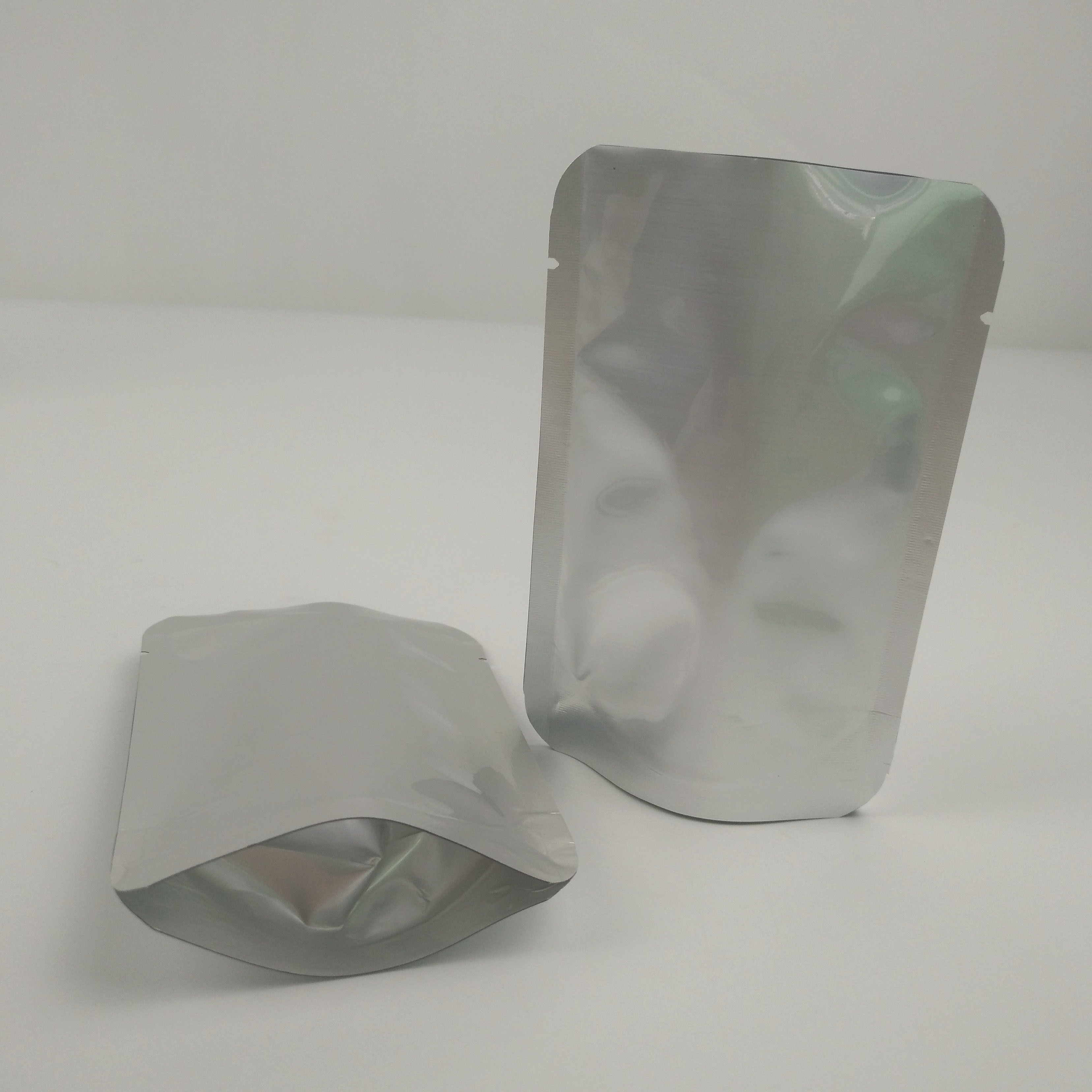 Bolso de empaquetado de aluminio del papel de la bolsa del sellado caliente de aluminio del papel de Mylar del almacenamiento de plata de plata claro de encargo de la comida con la muesca del rasgón